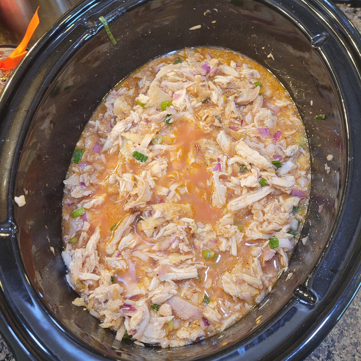 In crock pot combine chicken, onions, picante sauce, broth, salt & pepper together an mix well.