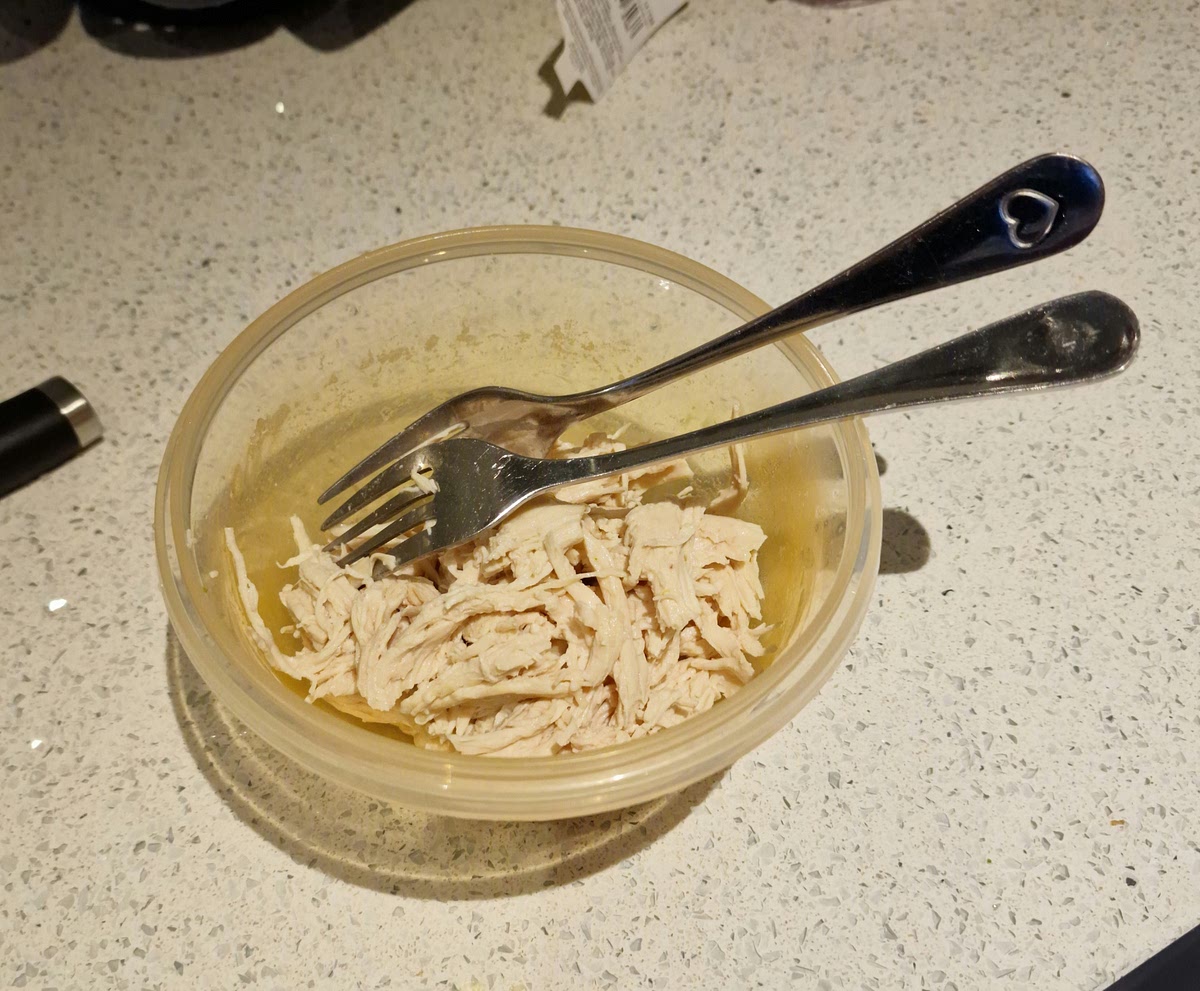 Pull chicken into strips using two forks