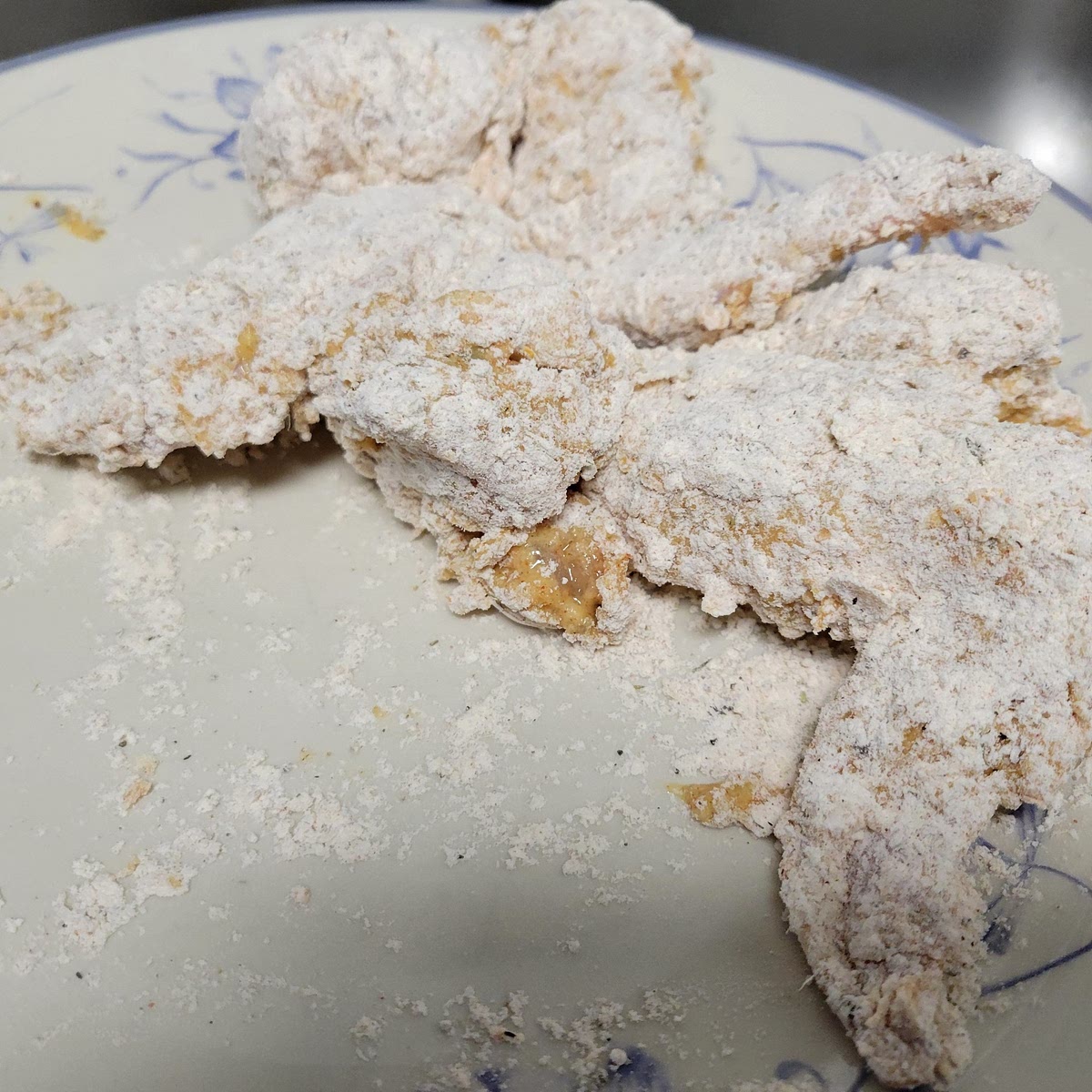 Dredge the chicken 1st in the wet mix, then in the dry mix. Repeat this step for a double dip. Pro tip: Use 1 hand for dredging in the wet mix and 1 hand for dredging in the dry mix in order to prevent clumpy flour in either mix.
