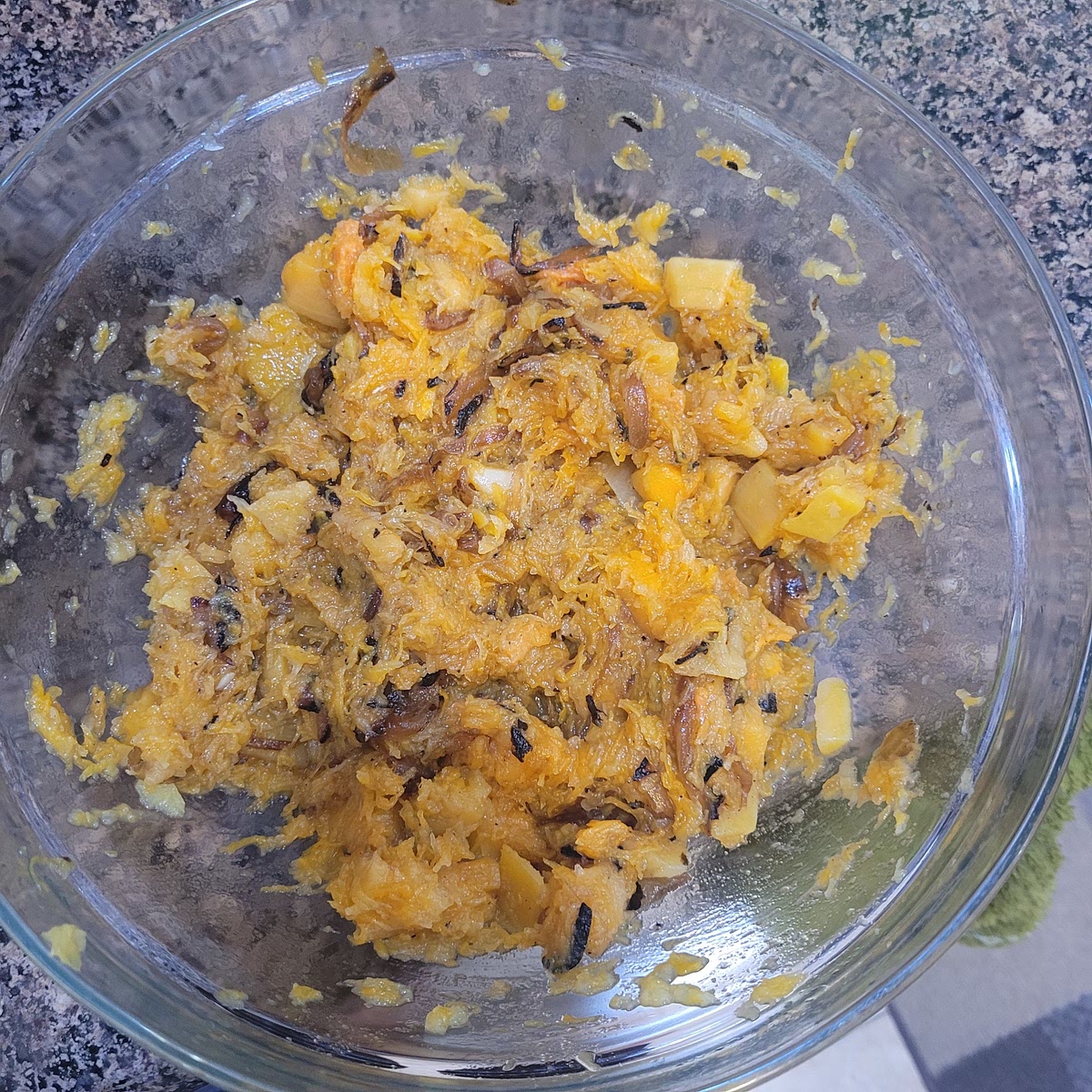 Scoop the flesh of the squash into a bowl and add the carmalized onions, season with salt & pepper and mash together.