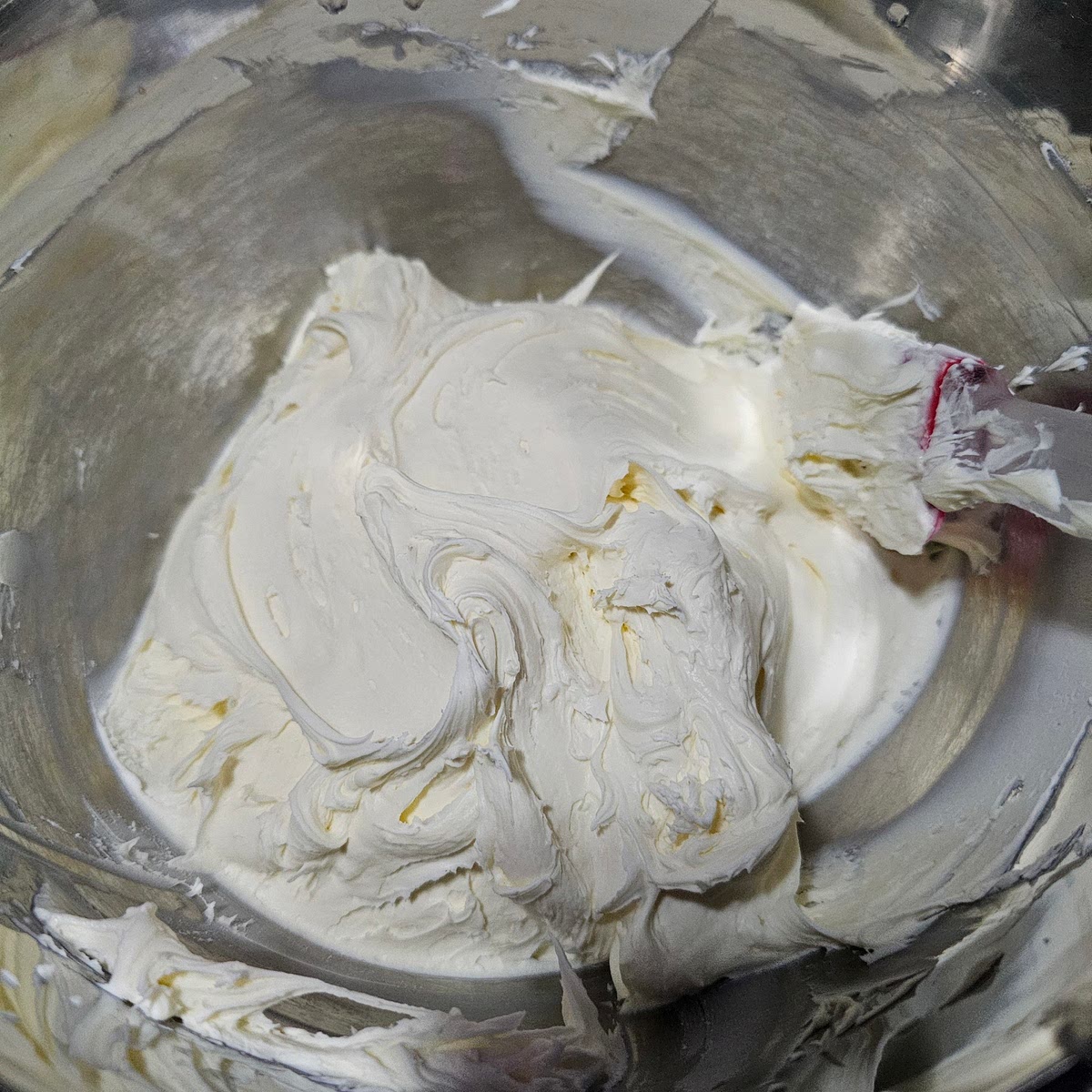 After weighing your mascarpone, add it to a large bowl and mix it with a powered hand mixer or table mixer. You're just getting it ready to incorporate with other ingredients. (See picture)