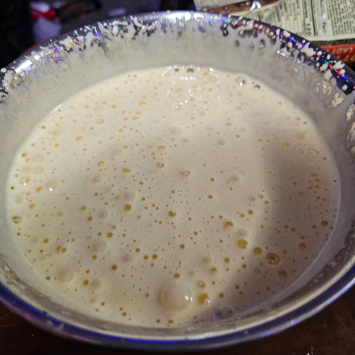 After they come to temp, immediately remove from heat and whisk vigorously, ideally with a whisk attachment on a mixer. You're going to whisk until the egg mixture turns to a creamy color and becomes light and fluffy. See picture.