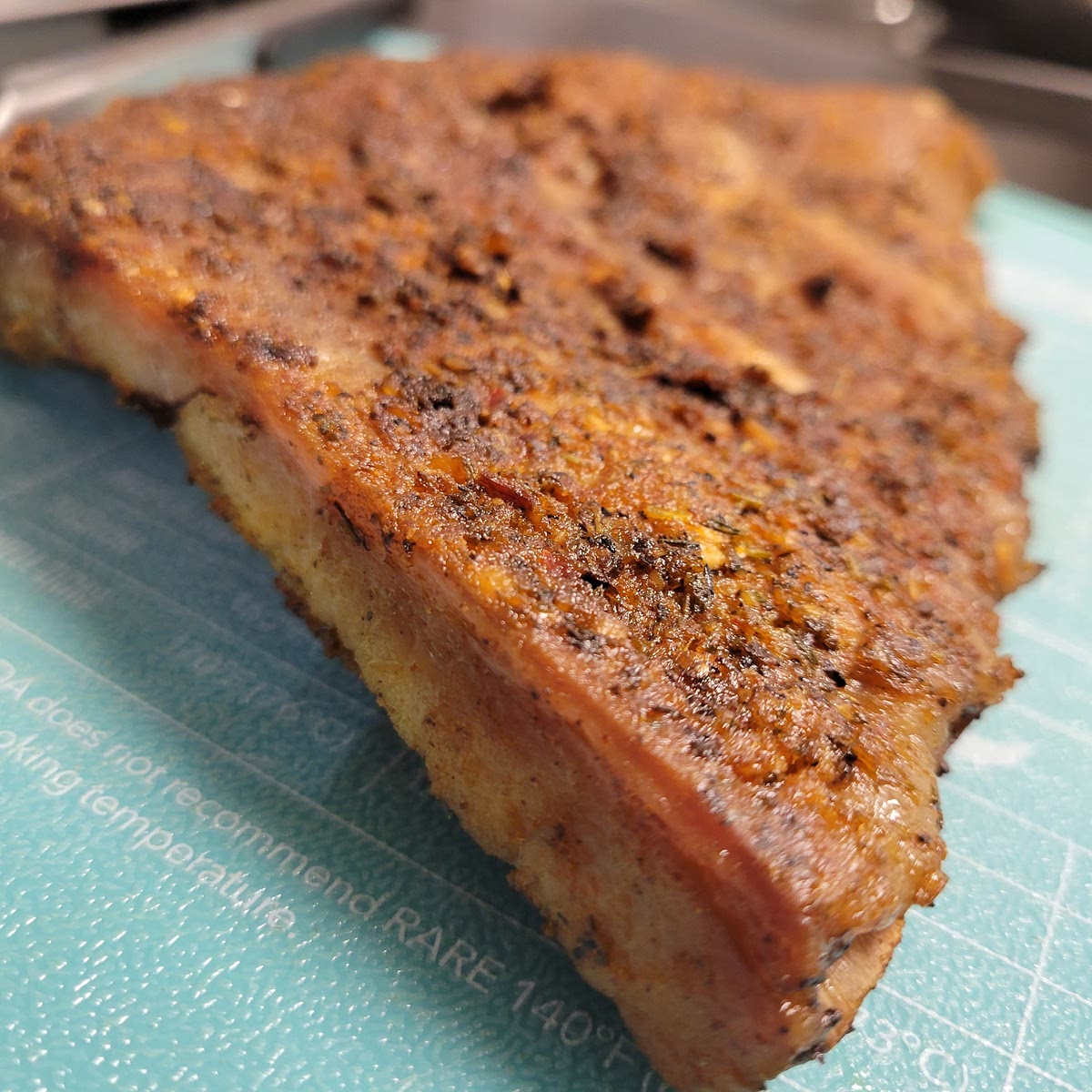 Carefully remove ribs from the oven and onto a large surface or cutting board. Remove the tinfoil and place back in the oven for 10 minutes. Remove again and baste with your choice of BBQ sauce. Cook uncovered for another 10 minutes or until internal temperature reaches at least 145°