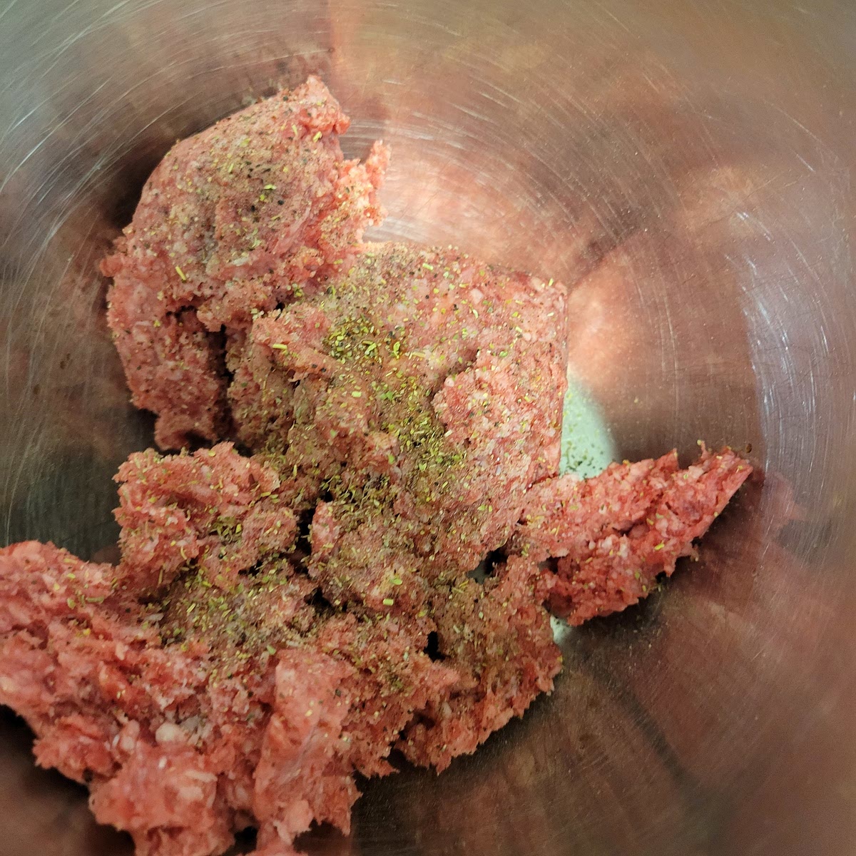 In a medium bowl combine ground beef, seasonings, egg yolk, and worchestershire sauce. In a separate medium add 1/2 cup of panko (optional)