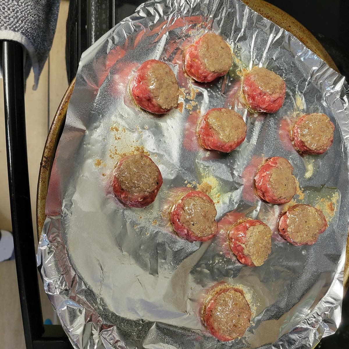 After 5 minutes carefully pull the meatballs from the oven and flip them on the other side. The bottoms should be turning brown with the pink facing up. Cook for 4 more minutes or until internal temperature reaches at least 145°. Serve with your favorite pasta or double the recipe for a great snack to share.