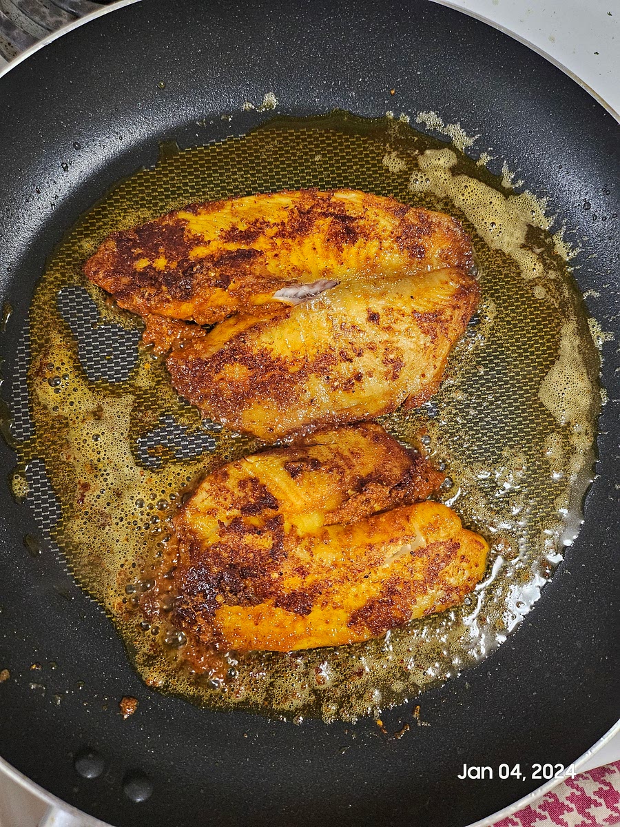 Fry the fish on both sides with lots of coconut oil. Fry on medium heat. Frying time depends on the size and thickness of the fish.