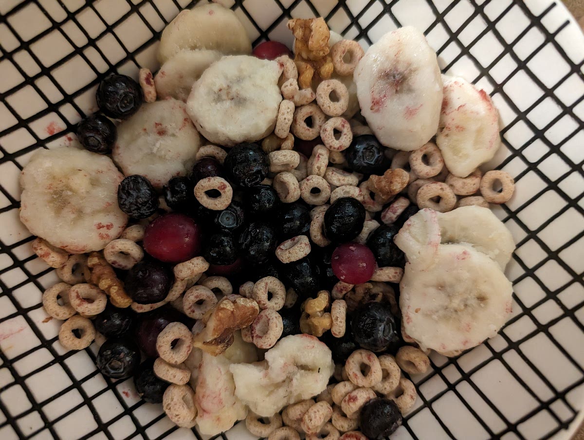 In a microwave safe bowl, combine ¾ cup Cheerios™, ¼ cup Blueberry & Banana Cheerios™ Veggie Blends, 1/4 cup blueberries, half a banana, 1-2 tablespoon of chopped nuts or seeds, 1-2 tablespoon of cranberries or dried fruit and 1/4 cup of skim milk or liquid of choice.