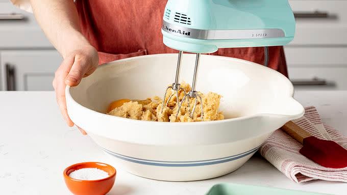 In large bowl, beat softened butter and sugars with electric mixer on medium speed, or mix with spoon about 1 minute or until fluffy, scraping side of bowl occasionally. Then beat in the egg and vanilla extract until smooth.