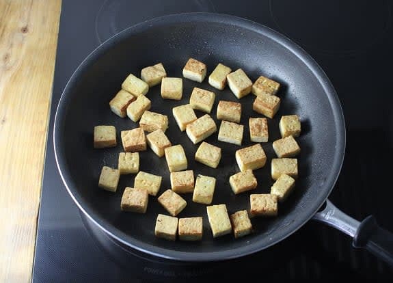 Cook the tofu
Pat the tofu dry with paper towel; cut into medium cubes. In a large pan, heat a drizzle of oil on medium-high. Add the tofu and cook, 2 to 3 min. per side, until golden and heated through.