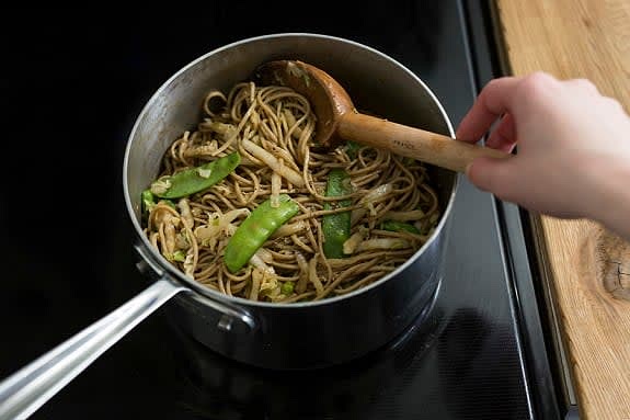 Combine the noodles & serve
To the pot of vegetables, add the noodles, sauce and S&P; stir well. Divide the noodles between your bowls. Top with the tofu. Garnish with the peanuts and remaining scallions. Bon appétit!