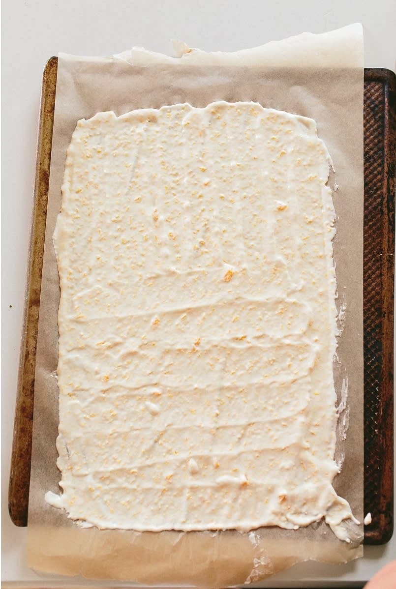 Pour onto a parchment lined cookie sheet. Spread out evenly and thin! The thinner you go the more thoroughly it will cook.