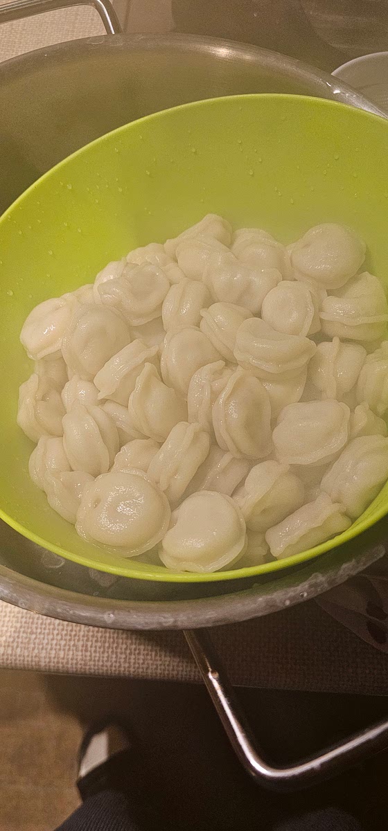 After 6 minutes, strain the pelmeni into a colander or strainer and let the water run off