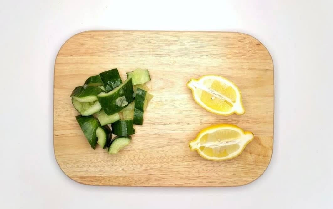 While the eggs] and fritters are cooking, bash your cucumber with a rolling pin and chop it roughly