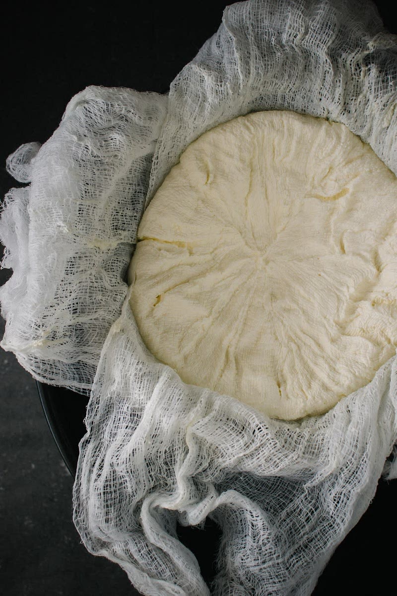 Gently squeeze out the excess liquid and remove labneh from cheesecloth. It should have the consistency of cream cheese.