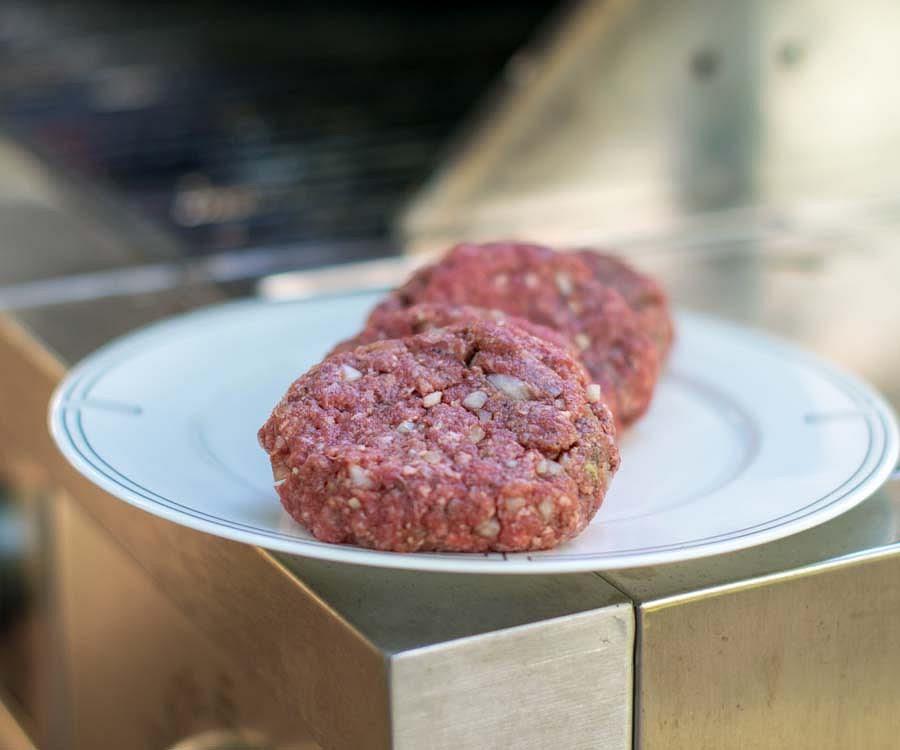 To form the burgers, split the mixture into equal parts and use your hands to form patties, working the meat until the patties hold together.