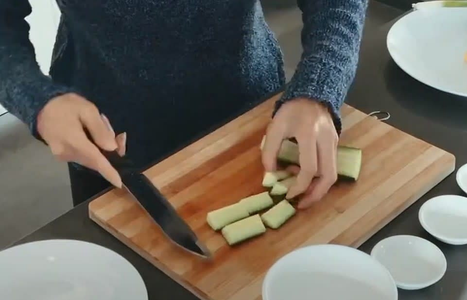 Chop cucumber into squares.