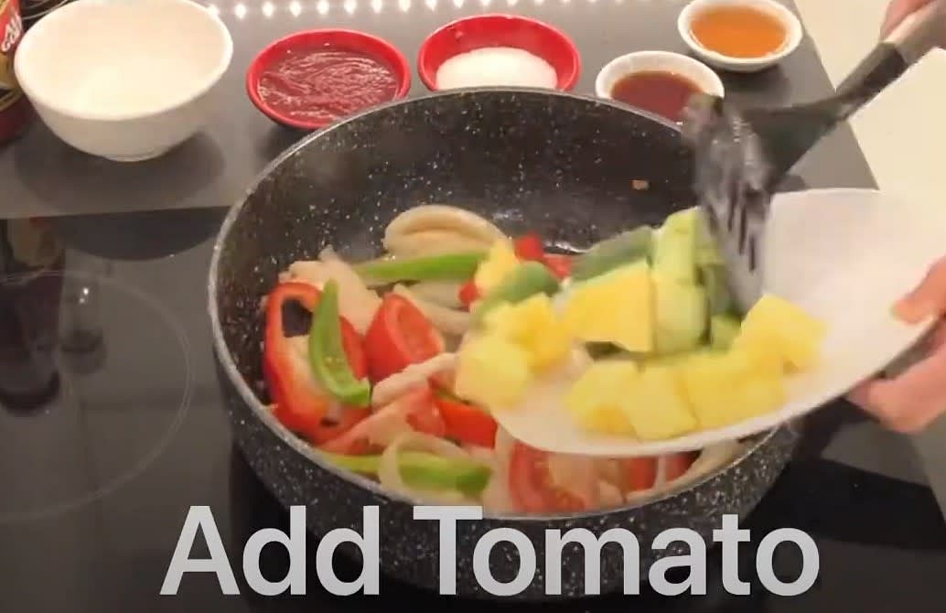 Add Tomato pieces and pineapple and stir fry a bit more