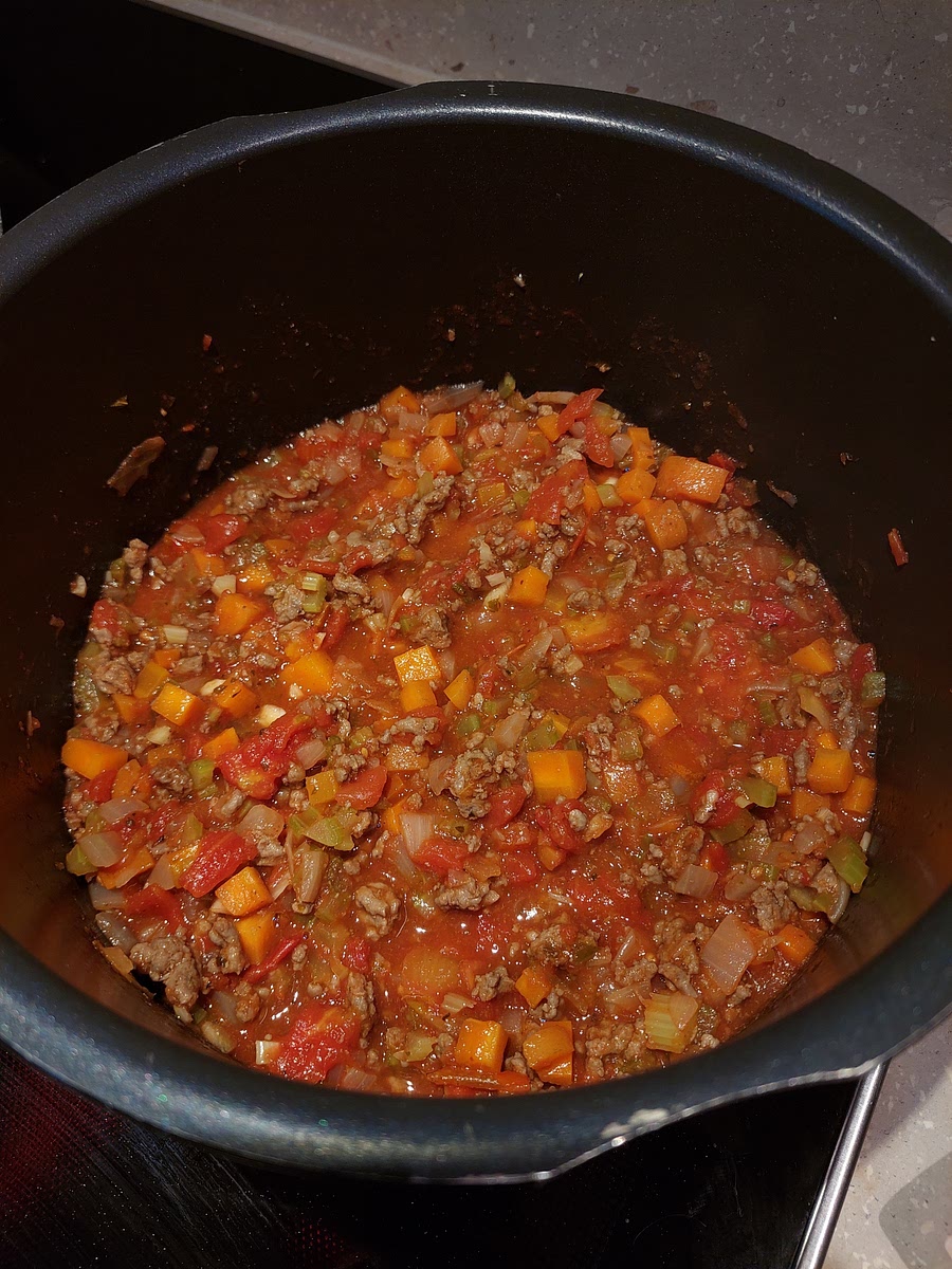 Add the canned tomatoes, star anise and wine or fish sauce. Stir it all together, then let it simmer with a lid on low-medium heat until you have the desired consistency (3~4 hours). Stir occasionally. If you need to make it faster, you can take the lid off. Now is a good time to clean up all the other ingredients.