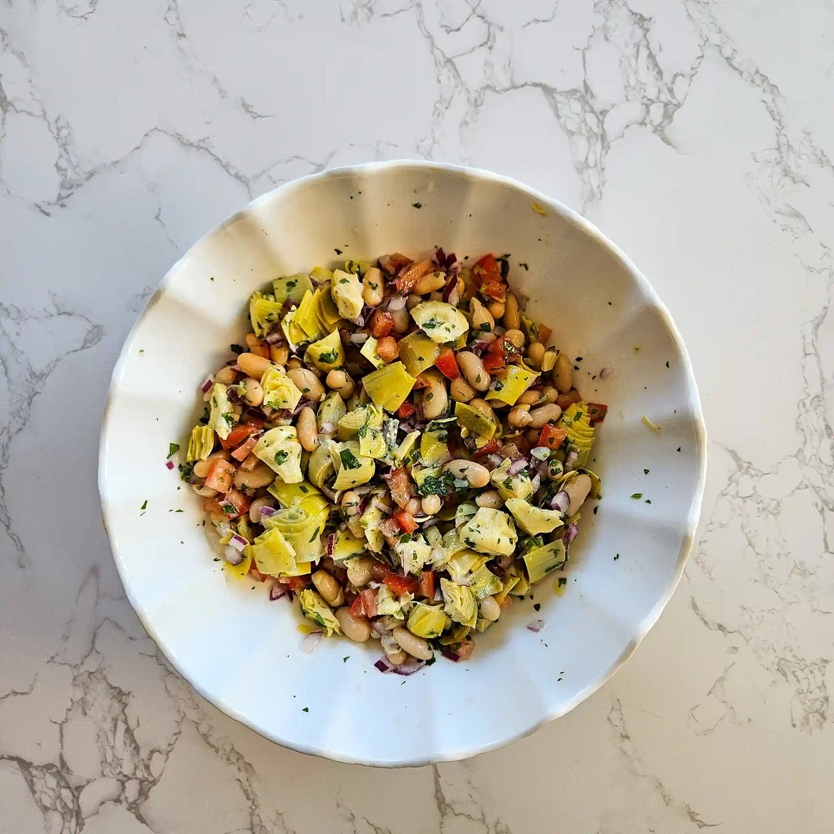 Pour the dressing over the salad mixture. Toss gently until all the ingredients are evenly coated with the dressing. Let the salad chill in the refrigerator for at least 30 minutes to allow the flavors to meld. Give it a quick toss before serving to redistribute the dressing and flavors.