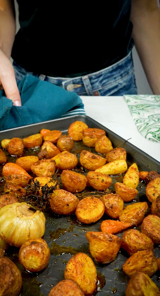 4. Roast for 25-30 minutes or until the potatoes are cooked through and crispy, flipping them halfway through.