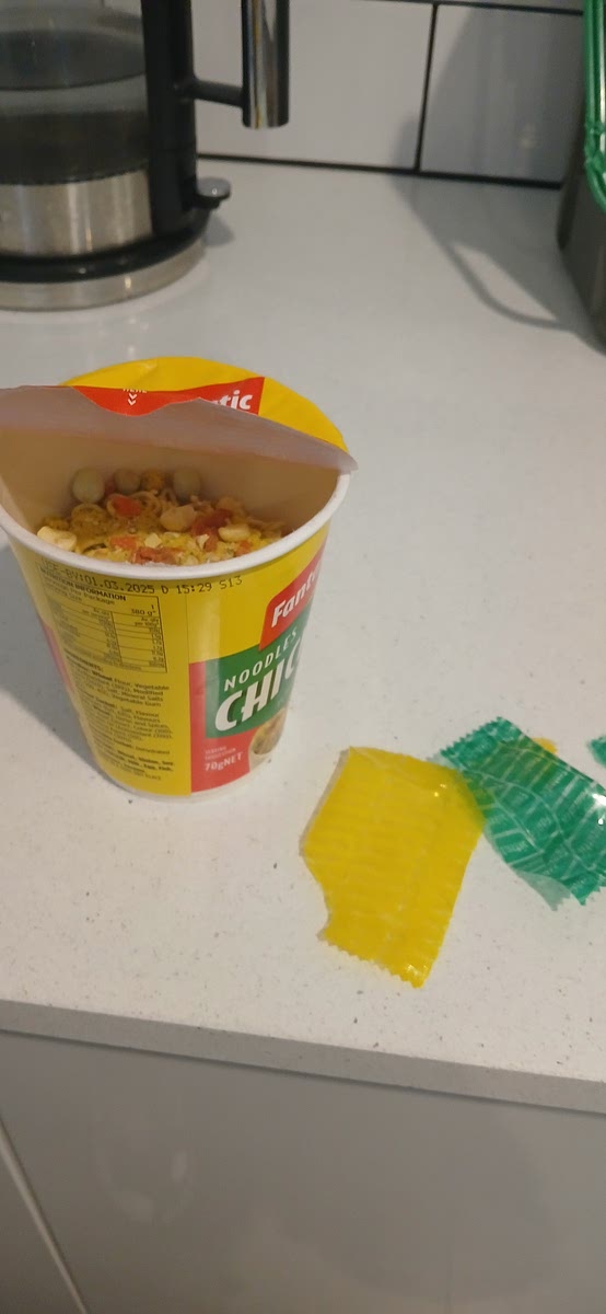 Carefully peel the packet and empty flavour packets.