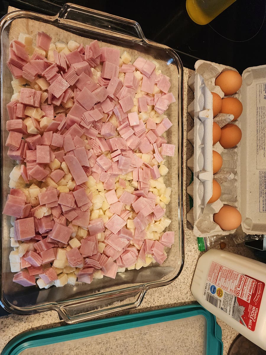 First layer the potatoes, next ham, next cheese