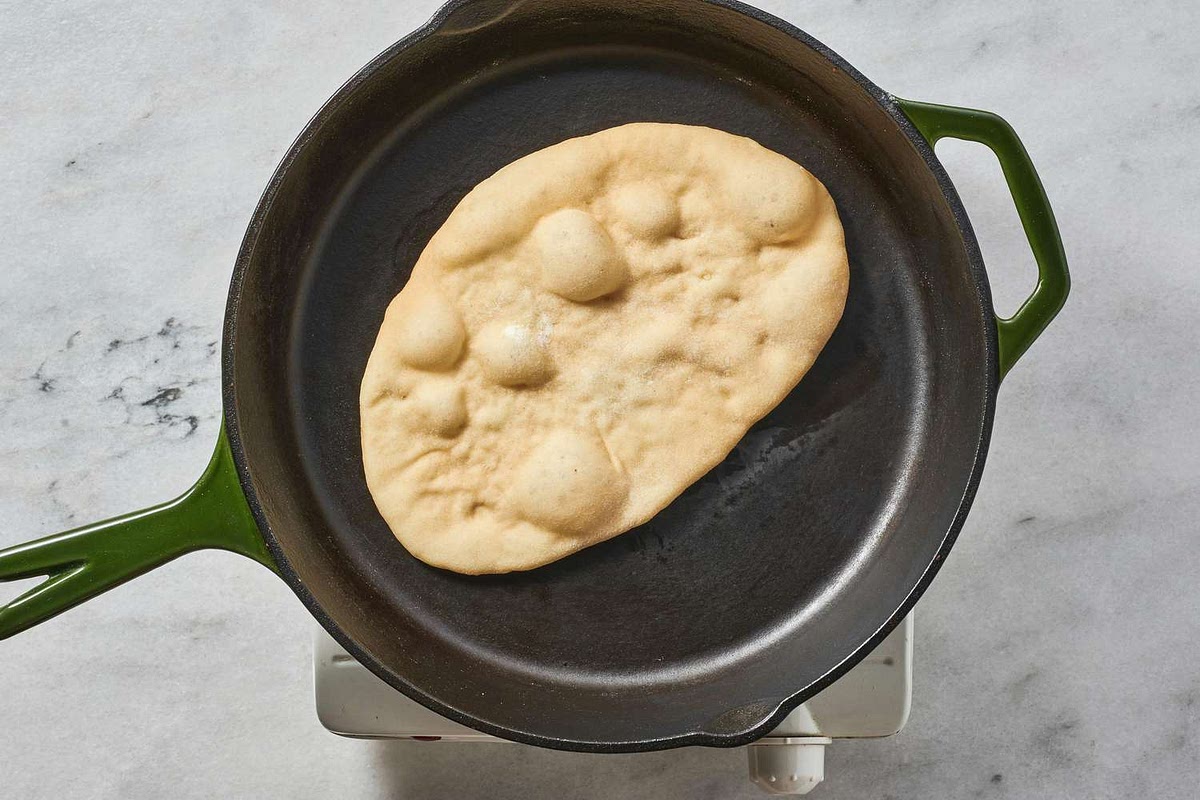 To a pre-heated pan, add your bread, flipping only when large bubbles are seen from the top.