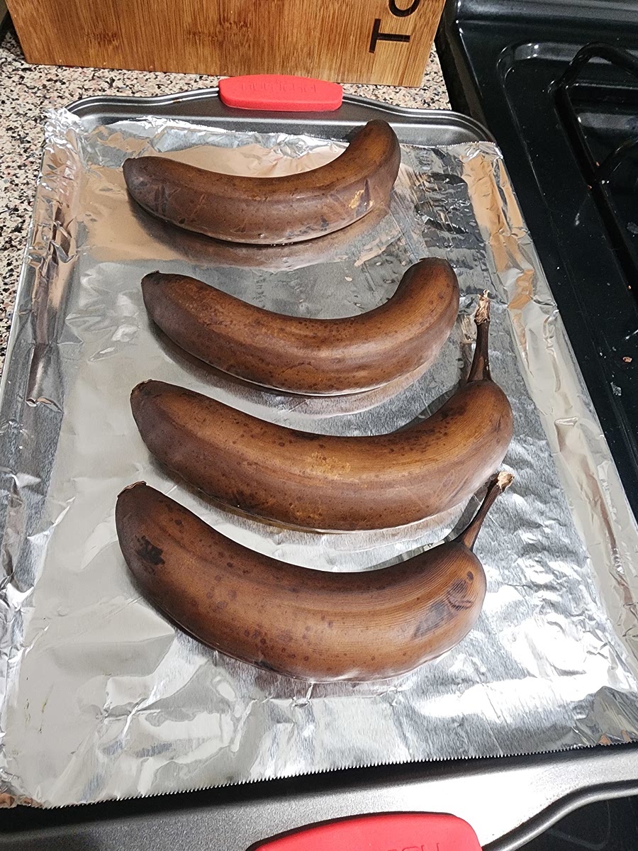 Ripen Bananas In the Oven .Preheat the oven to 300 degrees F (150 degrees C) and line a baking sheet with silicone or parchment. (The bananas may leak a little during baking.) Check every 15 minutes to see if they're soft enough. The less ripe your bananas to start, the longer they will take. The peels will turn black when ready, and the fruit will be soft and hot