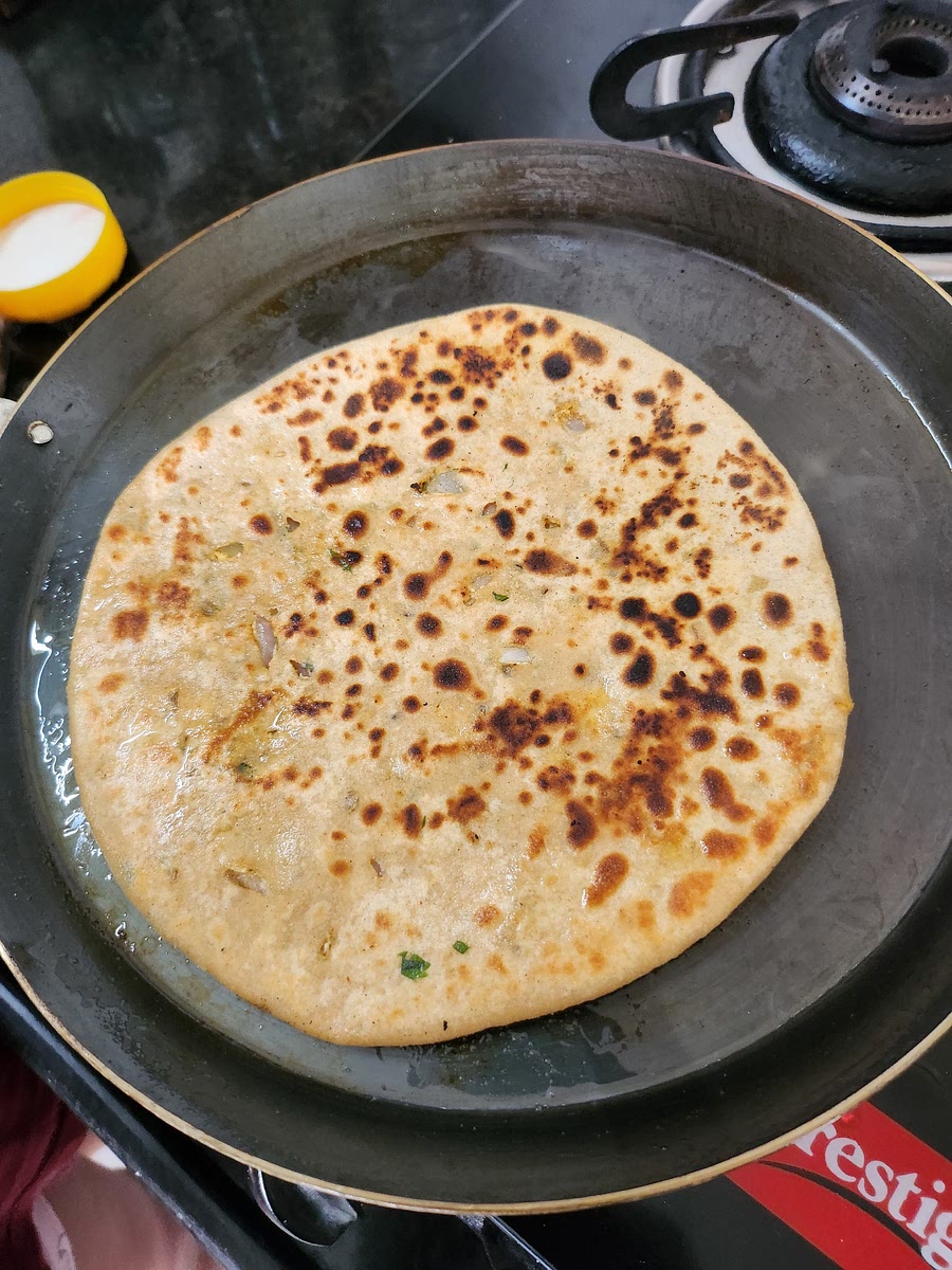 Roll it and toast in tawa with ghee till golden brown