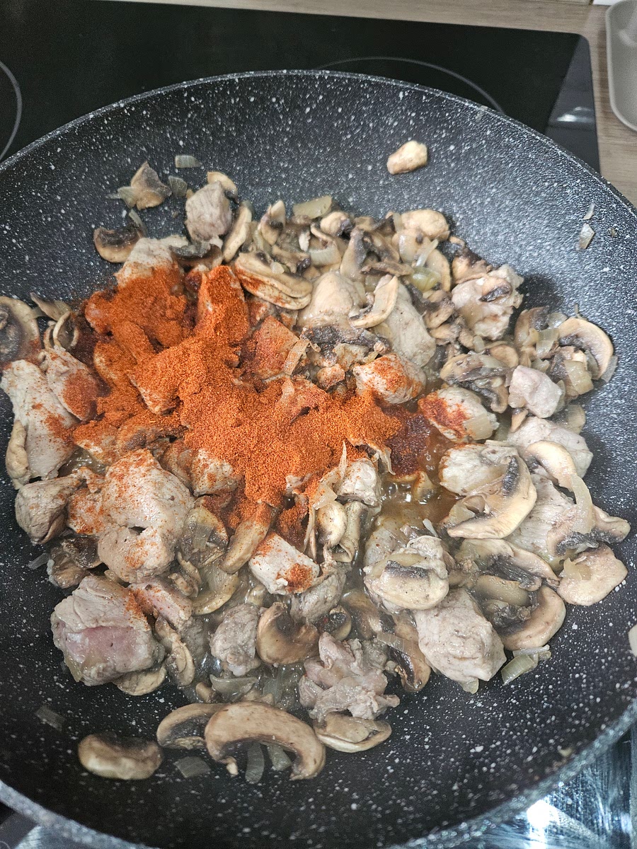 Stir in paprika to pan