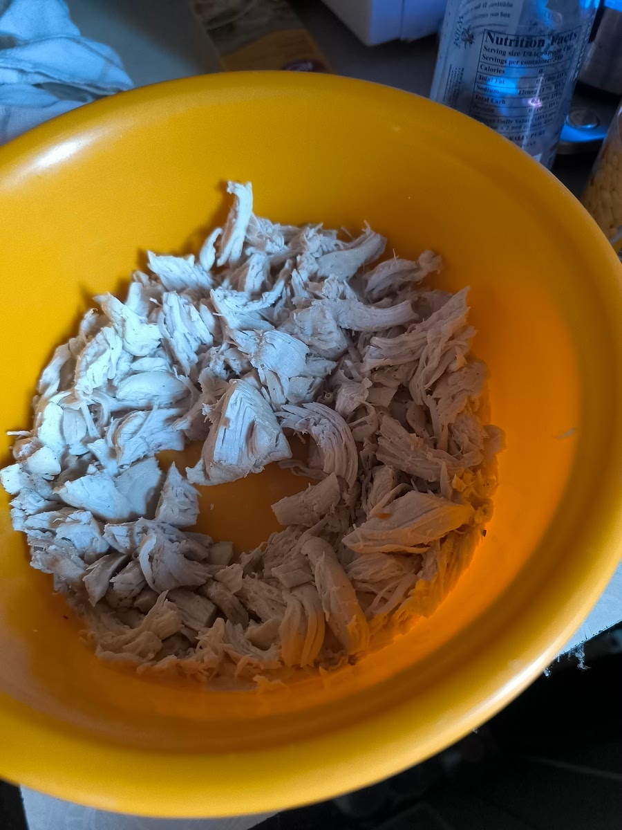 When chicken is ready, shred to pieces...