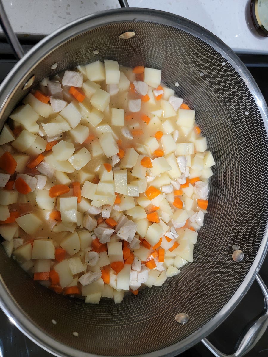 2. Put a medium to large stock pot to heat over medium-high. Once the pan is hot add 2Tbsp of cooking oil, diced onions and sauté for 5 min. Add minced garlic clove and sauté for another 2 minutes. Add diced chicken breasts and cook until mostly cooked.