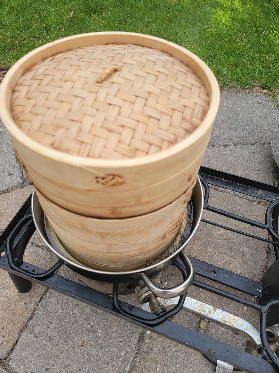 Heat up steamer racks in an inch or a bit of warm water