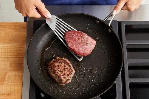 Meanwhile, pat the steaks dry with paper towels; season with salt and pepper on all sides. In a medium pan (nonstick, if you have one), heat a drizzle of olive oil on medium-high until hot. Add the seasoned steaks. Cook, turning occasionally, 6 to 10 minutes for medium-rare (125°F), or until browned and cooked to your desired degree of doneness.* Leaving any browned bits (or fond) in the pan, transfer to a cutting board; let rest at least 5 minutes.