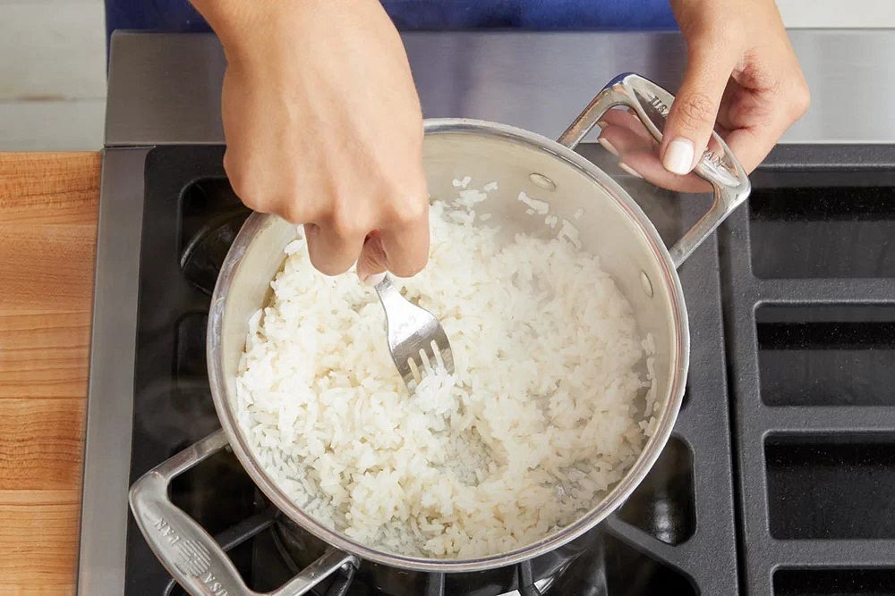 Meanwhile, carefully rinse the rice (sifting through for any impurities). Drain thoroughly. In a small pot, combine the rice, a big pinch of salt, and 1 cup of water. Heat to boiling on high. Once boiling, reduce the heat to low. Cover and cook, without stirring, 13 to 15 minutes, or until the water has been absorbed and the rice is tender. Turn off the heat and fluff with a fork. Cover to keep warm.