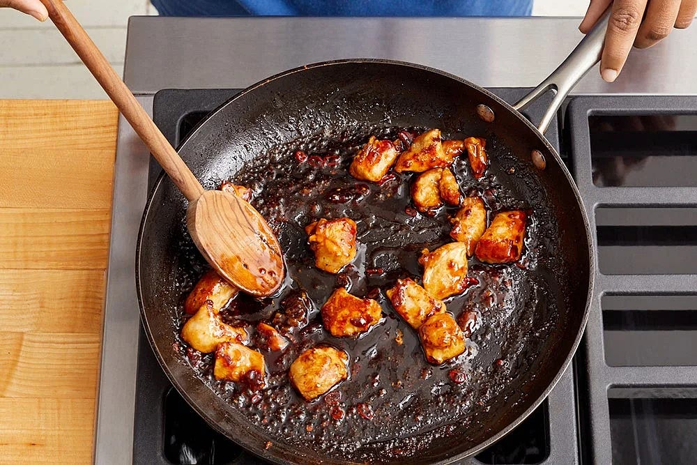In the same pan, heat a drizzle of olive oil on medium-high until hot. Carefully add the marinated chicken (including any liquid) in an even layer. Cook, without stirring, 3 to 4 minutes, or until lightly browned. Continue to cook, stirring occasionally, 1 to 2 minutes, or until browned. Add the sauce (carefully, as the liquid may splatter). Cook, stirring constantly, 1 to 2 minutes, or until the chicken is coated and cooked through. Turn off the heat. Serve the cooked rice topped with the cooked broccoli and cooked chicken (including any sauce from the pan). Garnish with the peanuts and sliced green tops of the scallions. Enjoy!