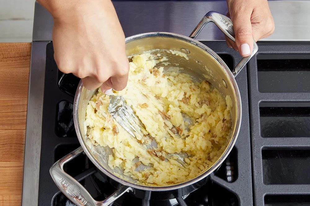 Add the diced potatoes to the pot of boiling water and cook 16 to 18 minutes, or until tender when pierced with a fork. Turn off the heat. Drain thoroughly and return to the pot. Add the buttermilk. Using a fork or potato masher, mash to your desired consistency. Taste, then season with salt and pepper if desired. Cover to keep warm.