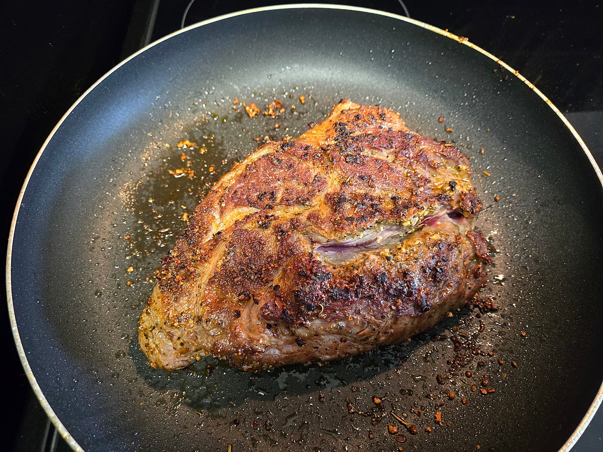 Sear roast on high heat, ensuring a nice crust on all sides. Carefully, add the roast and potato mixture to the Crockpot.