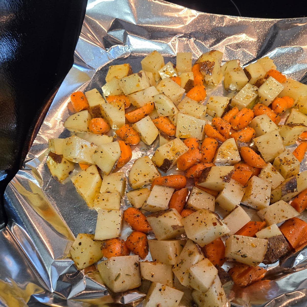 Season Roast and set aside. Peel, & chop carrots, and potatoes. Then add them to a medium bowl and add any leftover seasoning mix. Set aside