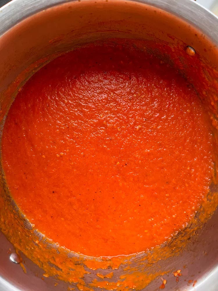 The original recipe calls for removing and discarding the onion from the sauce. I never do this. Since I don’t skin or core the tomatoes and prefer my sauce smooth, I stick an immersion blender into the pot to blend the tomatoes and onions. The resulting sauce is thick and deeply flavorful. No wonder this is the only recipe I'll ever make.