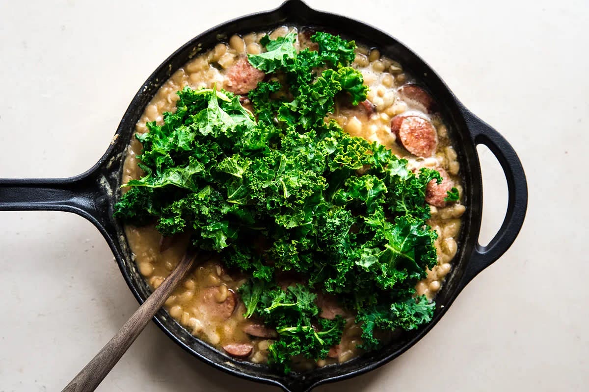 Add the kale, reduce the heat to medium-low and cook, stirring often until sauce becomes creamy, is slightly reduced and kale has wilted, about 2 minutes more.