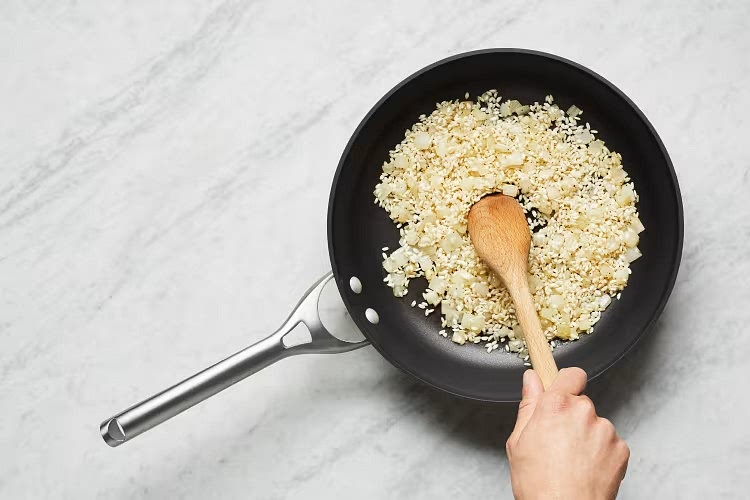 • Heat a drizzle of olive oil in same pan over medium heat. Add onion; cook, stirring, until slightly softened and lightly browned, 2-3 minutes. • Add garlic, rice, and 1⁄2 TBSP plain butter (1 TBSP for 4 servings). Cook, stirring, until garlic is fragrant and rice is translucent, 1-2 minutes. Season with salt and pepper.