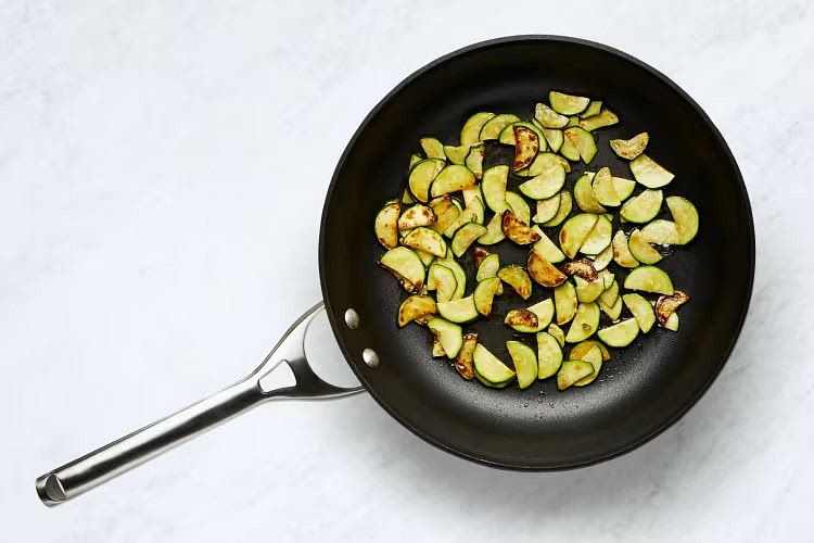 • Heat a large drizzle of olive oil in a large pan over medium-high heat. Add zucchini and as much chili as you like; cook, stirring occasionally, until zucchini is lightly browned, 2-3 minutes.