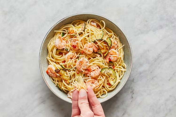 • Divide pasta between bowls. Top with remaining Parmesan and a drizzle of olive oil. Garnish with any remaining chili to taste and serve. Shrimp are fully cooked when internal temperature reaches 145°.