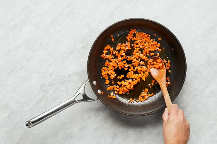 • While cavatappi cooks, heat a drizzle of oil in a large pan over medium heat. Add carrot; cook, stirring, until browned and tender, 6-8 minutes. Season with salt and pepper.