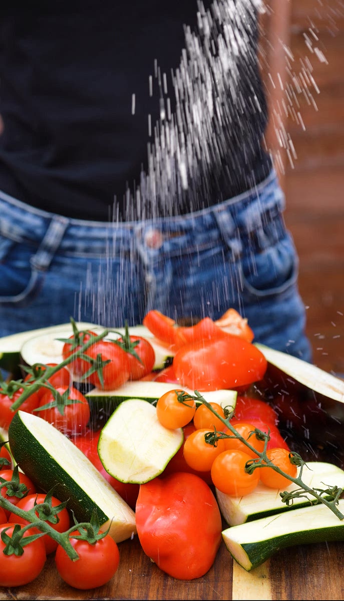 4. Season the vegetables with salt, pepper, and olive oil.