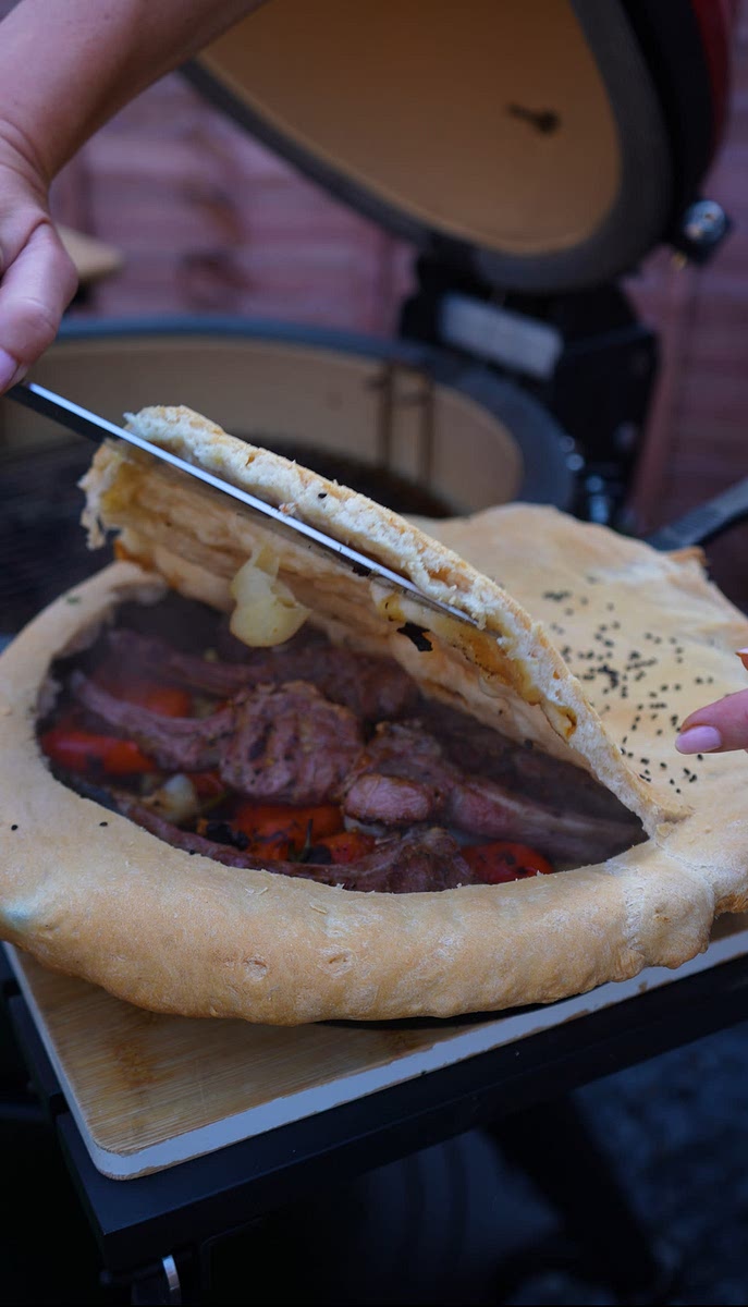 8. Once done, score the dough with a knife, open it, garnish with chopped coriander, and enjoy!