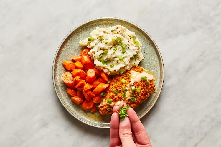 • Carefully transfer roasted carrots to a large bowl; add 1 TBSP butter and toss until melted. • Divide carrots, mashed potatoes, and chicken between plates. Drizzle chicken with creamy Buffalo sauce and honey (or serve on the side for dipping). Garnish potatoes and chicken with scallion greens and serve. Chicken is fully cooked when internal temperature reaches 165°.