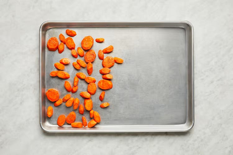 • While potatoes cook, lightly oil a baking sheet. • Toss carrots on one side of sheet with a drizzle of oil, salt, and pepper (for 4 servings, spread out across entire sheet). Roast on top rack for 5 minutes (you’ll add the chicken to the baking sheet then).