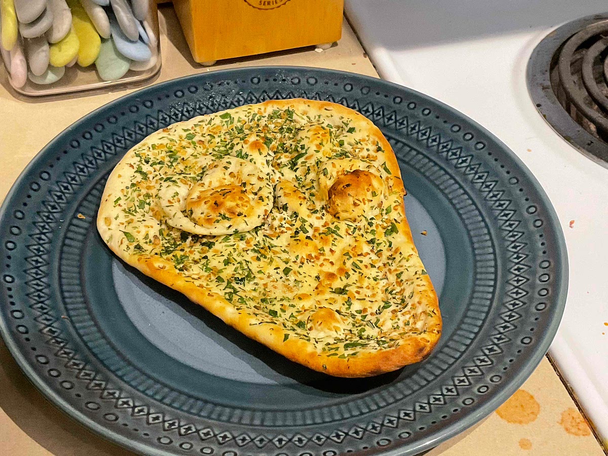 Place store-bought naan into the air fryer at 350° for 3 minutes (or until crispy)